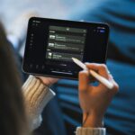 A woman navigating through her Ipad