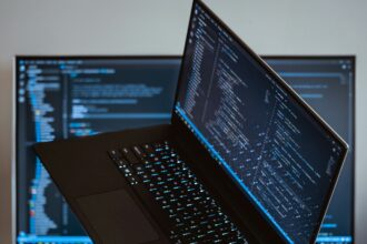 A picture of a laptop on a finger